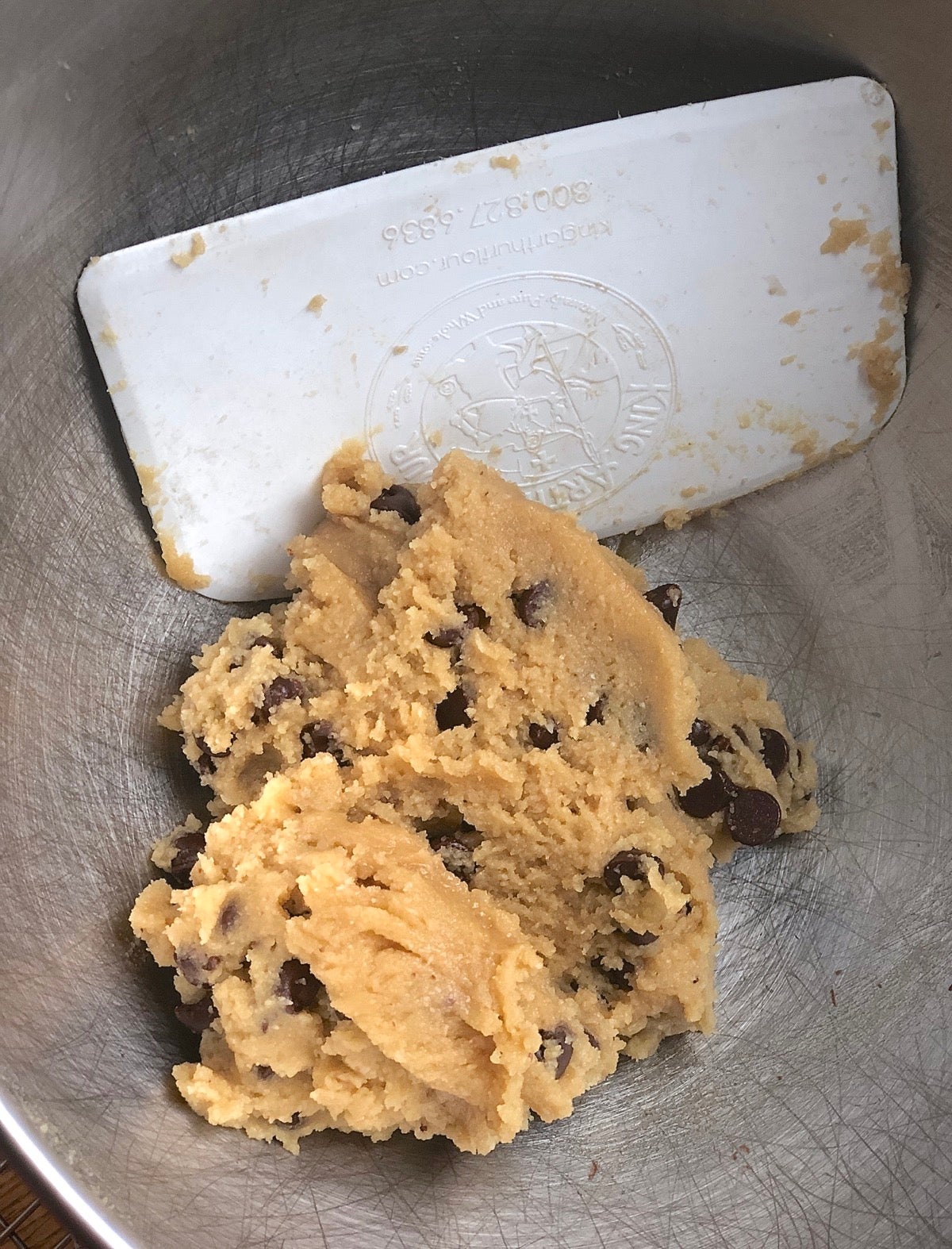 Dough for Gluten-Free Almond Flour Chocolate Chip Cookies mixed in a bowl, ready to scoop.