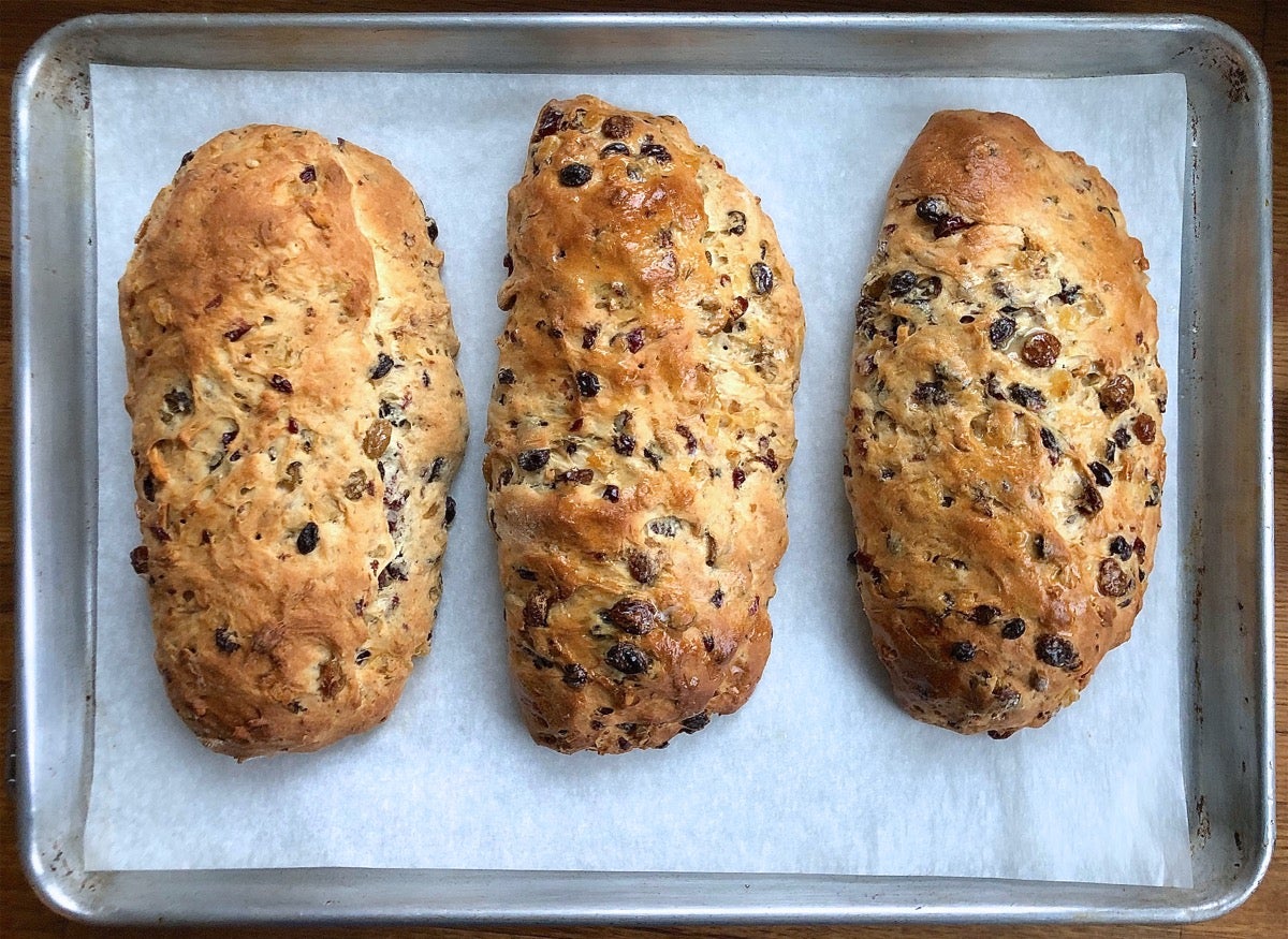 Hot stollen on a baking sheet, fresh from the oven.