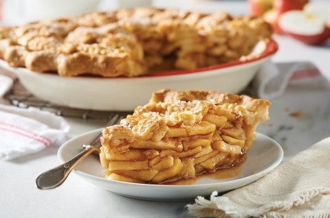 Slice of apple pie, showing abundant filling
