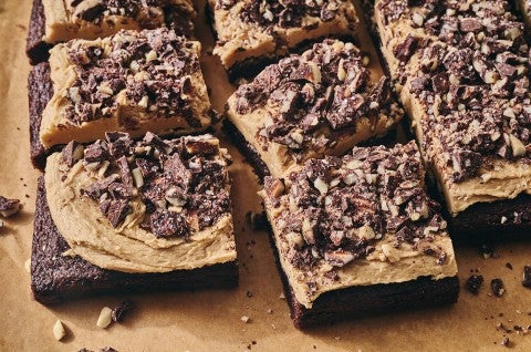 Chocolate Caramel Almond Crunch Brownies sliced and photographed on a counter. - select to zoom