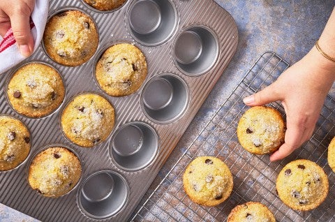Removing Easy Chocolate Chip Muffins from a muffin pan - select to zoom