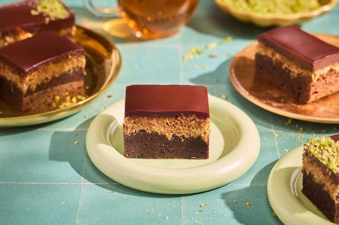 Dubai Chocolate Brownies on plates arranged on a counter - select to zoom