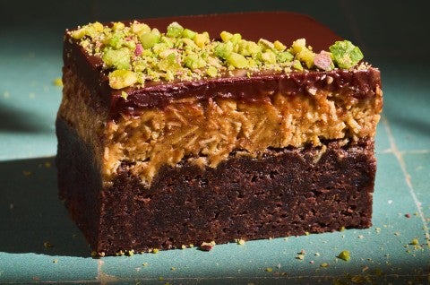 A Dubai Chocolate Brownie on a countertop with dramatic lighting. - select to zoom
