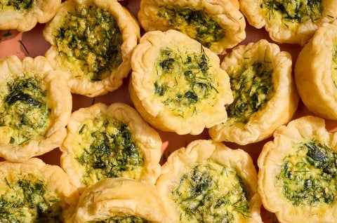 Mini Quiches arranged in a pile seen from above - select to zoom