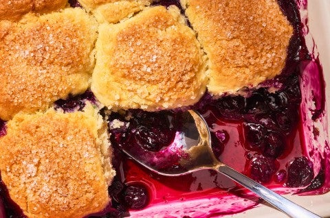 Close-up shot of Sourdough Discard Blueberry Cobbler in a pan - select to zoom