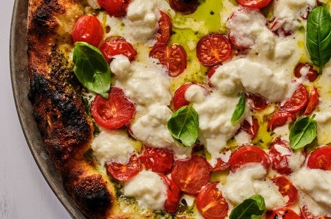 Overhead view of fresh baked caprese style NY pizza - select to zoom