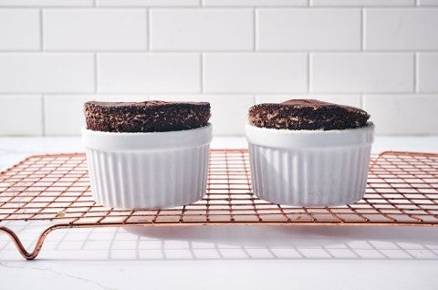 Flourless Chocolate Lava Cake in ramekins on a cooling rack - select to zoom