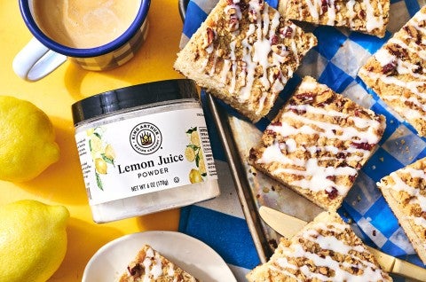 Lemon Streusel Coffee Cake on a counter with a jar of Lemon Juice powder from King Arthur Baking - select to zoom