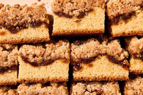 Slices of Apple Crumb Cake stacked and arranged neatly - select to zoom