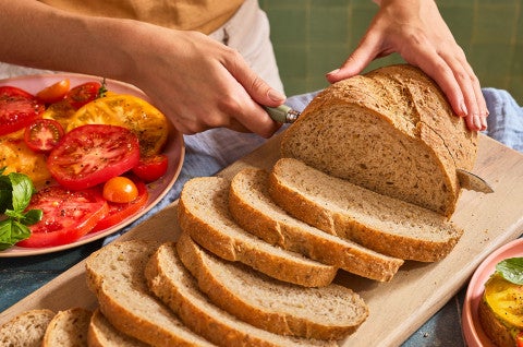 Slices of Seeded Multigrain Sourdough Bread on a cutting board - select to zoom