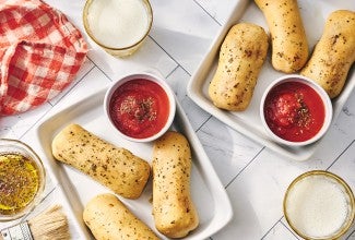 Cheese Stuffed Breadsticks arranged on plates.