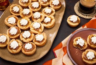 Mini Pumpkin Pies arranged no plates
