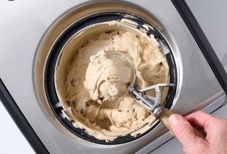 Ice cream being scooper from an ice cream maker