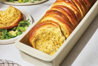 Butterflake Herb Loaf in a pan showing the buttery and herbaceous interior