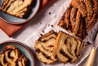 Cinnamon Babka slices arranged on a counter with thick swirls of cinnamon