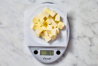 Cubed butter on a digital scale