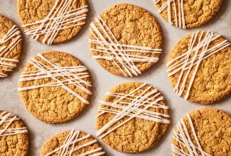 Crispy Brown Butter Cookies seen from above evenly spaced on a counter