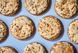 Gingerbread Latte Cookies arranged on a blue surface