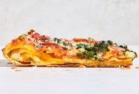 Sideview of a slice of Flaky Puff Crust Pizza