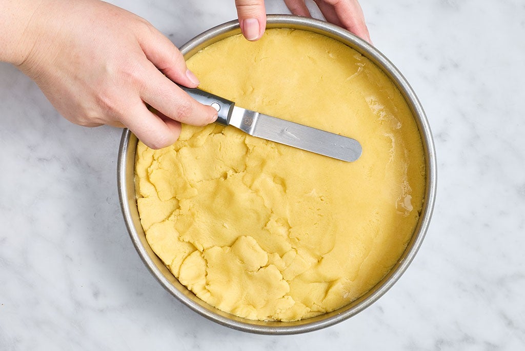 Smoothing the top crust of Gâteau Breton