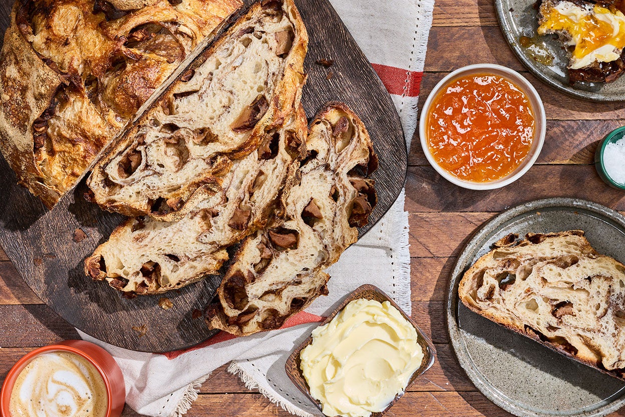 Apple Cinnamon Sourdough Bread sliced and seen from above with decorations on a counter