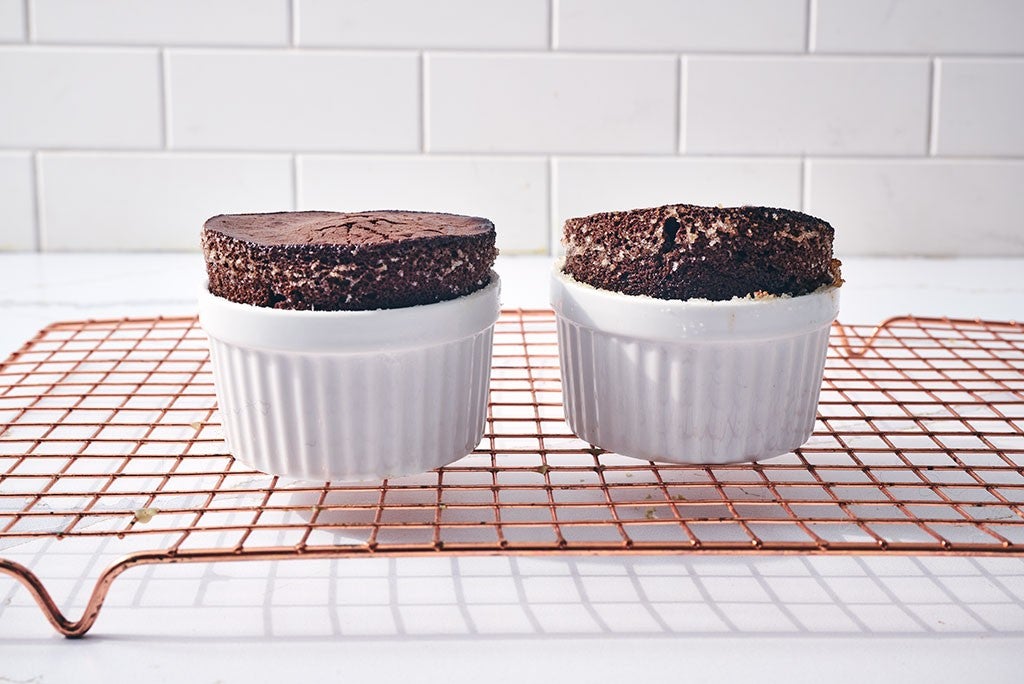 Flourless Chocolate Lava Cakes in ramekins on a cooling rack