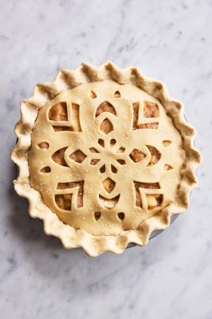 Unbaked pie with a design in the crust
