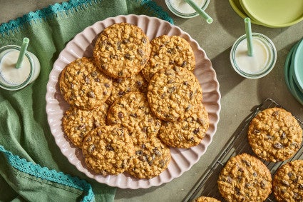 A pile of The Softest Oatmeal Raisin Cookies on a plate seen from above.