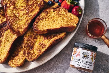 French Toast on a plate with a jar of Maple Cinnamon from King Arthur Baking