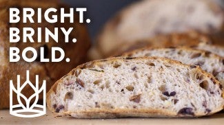 Video Thumbnail Image of Preserved Lemon and Olive Bread with text that says "Bright. Briny. Bold"